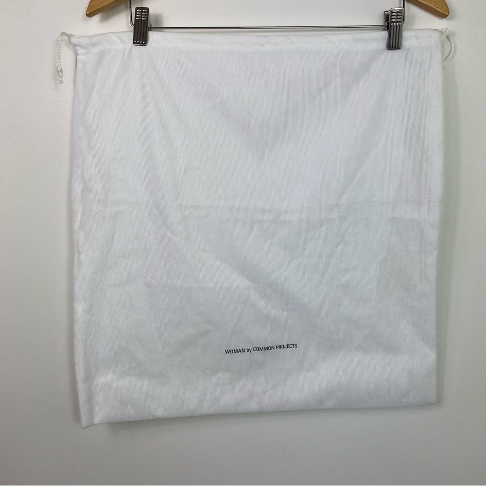Woman by common projects dust bag white square